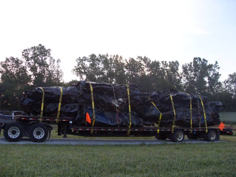 Harvestore Silos being Hauled in for Scrap